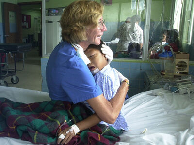 Child smiling after Mission Plasticos reconstructive surgery