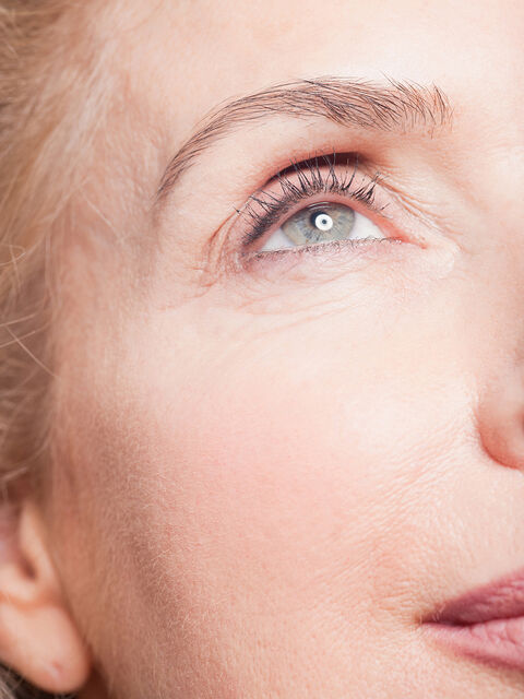 Close-up of a woman's eye and brow with smooth, refreshed skin
