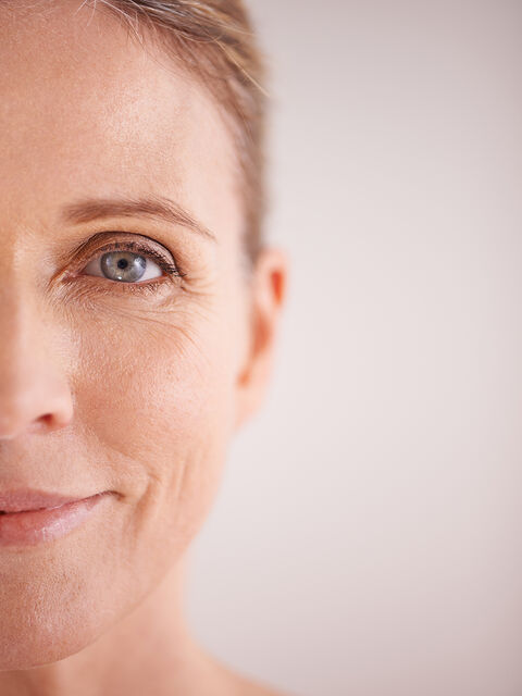 Close-up of a woman's face with bright, open eyes