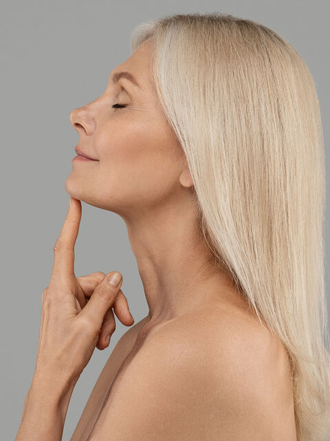 Profile of a woman with a smooth, defined jawline and neck